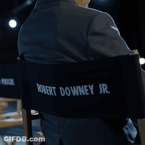 Man In Suit Sitting In Pedro Pascal Jr Chair GIF