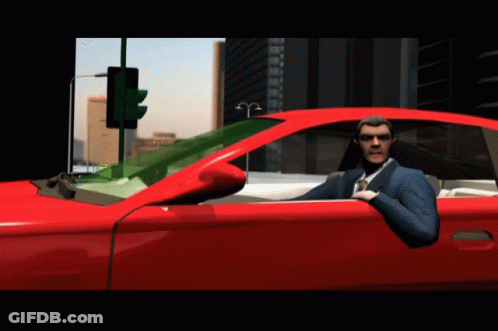 Man In Suit Sitting In Red Car GIF