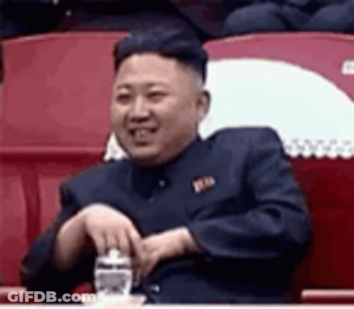 Man In Suit Sitting In Stadium Holding Water GIF