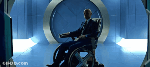 Man In Suit Sitting In Wheelchair GIF