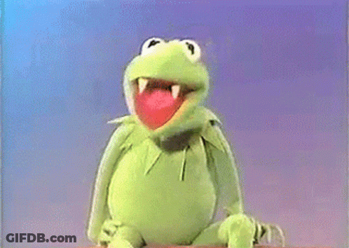 Man In Suit Sitting Next To Muppet Frog GIF