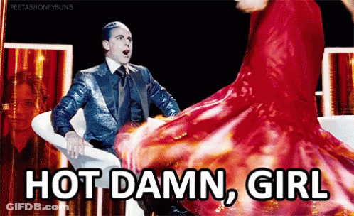 Man In Suit Sitting Next To Woman In Red Dress Dancing GIF