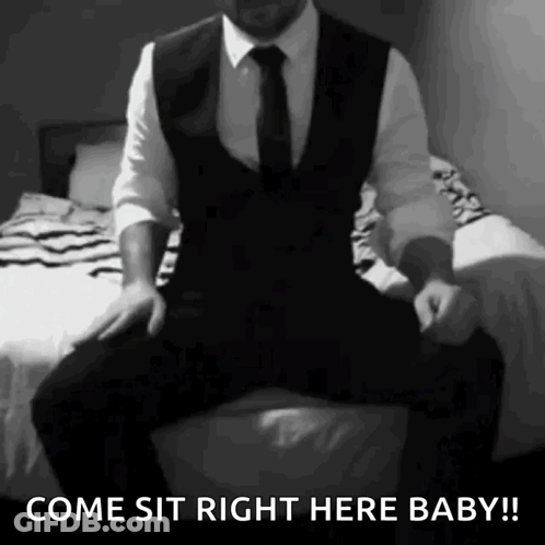Man In Suit Sitting On Bed Come Sit Baby GIF