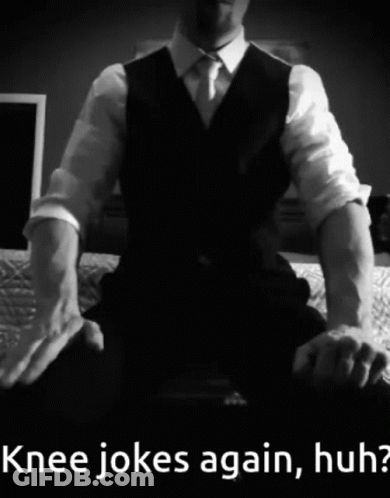 Man In Suit Sitting On Bed Knee Jokes Again Huh GIF