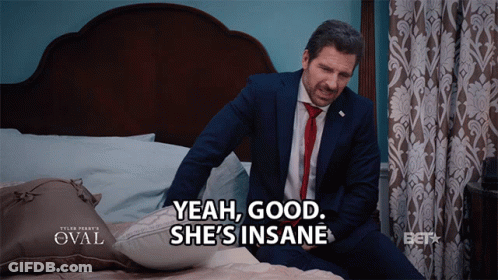 Man In Suit Sitting On Bed Says Yeah Good She's Insane GIF