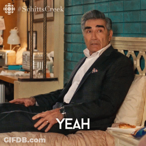 Man In Suit Sitting On Bed Yeah GIF