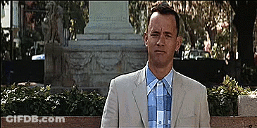 Man In Suit Sitting On Bench GIF