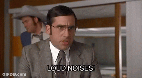 Man In Suit Sitting On Couch GIF