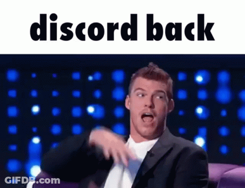 Man In Suit Sitting On Couch Discord Back GIF