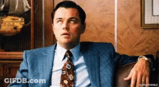 Man In Suit Sitting On Couch GIF