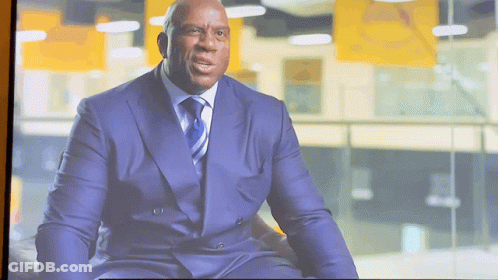 Man In Suit Sitting On Couch GIF