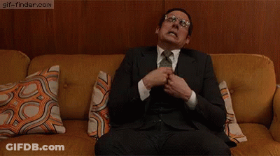 Man In Suit Sitting On Couch GIF