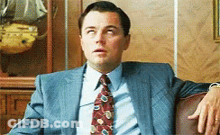 Man In Suit Sitting On Couch GIF