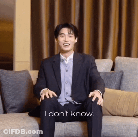 Man In Suit Sitting On Couch Saying I Don't Know GIF