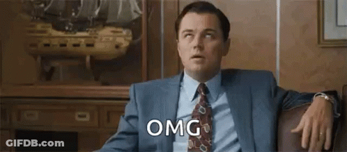 Man In Suit Sitting On Couch GIF