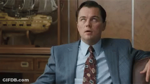Man In Suit Sitting On Couch GIF
