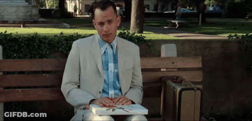 Man In Suit Sitting On Park Bench With Book GIF