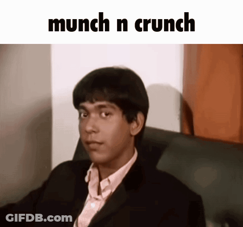 Man In Suit Sitting Under Munch N Crunch GIF