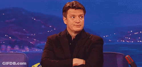 Man In Suit Sitting With Arms Crossed GIF