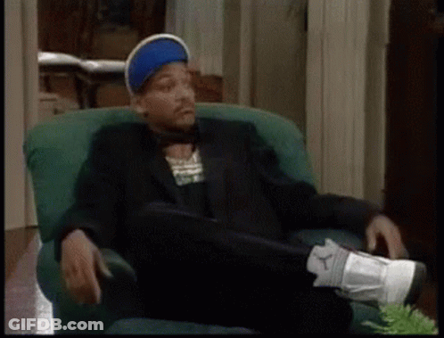 Man In Suit Sitting With Feet Up GIF