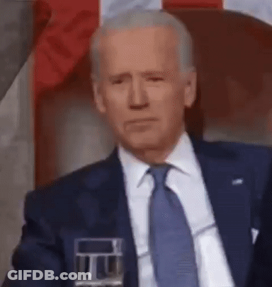 Man In Suit Sitting With Glass Of Water GIF