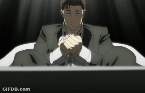 Man In Suit Sitting With Hands Folded GIF
