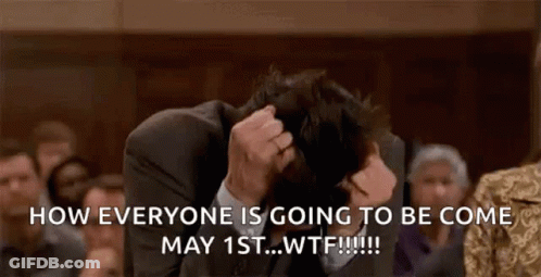 Man In Suit Sitting With Head In Hands GIF