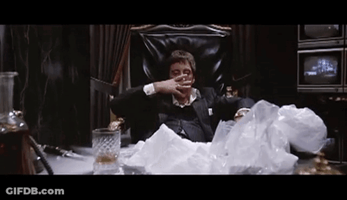 Man In Suit Sitting With Whiskey And Cigarette GIF