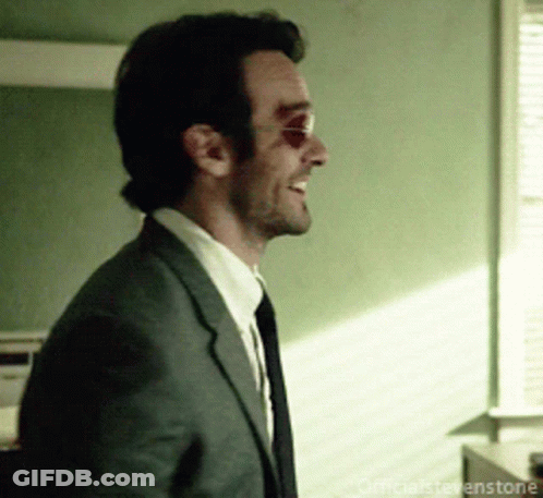 Man In Suit Smiling GIF