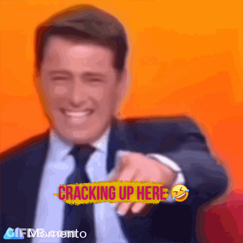 Man In Suit Smiling And Pointing GIF