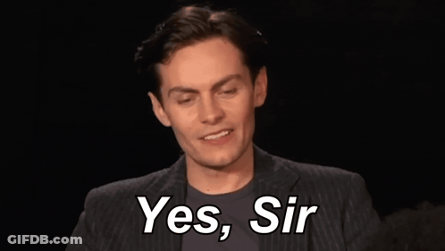 Man In Suit Smiling And Saying Yes Sir GIF