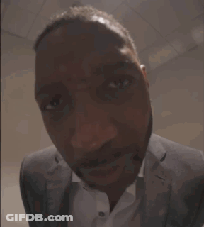 Man In Suit Smiling At Camera GIF