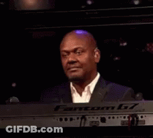 Man In Suit Smiling At Keyboard GIF