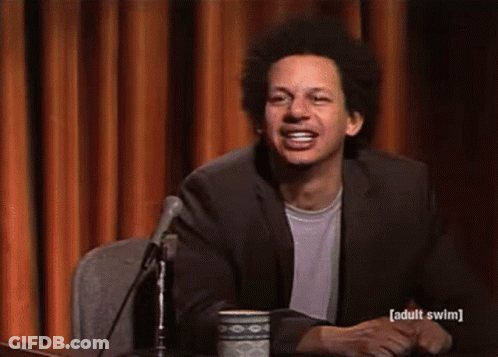 Man In Suit Smiling At Microphone GIF