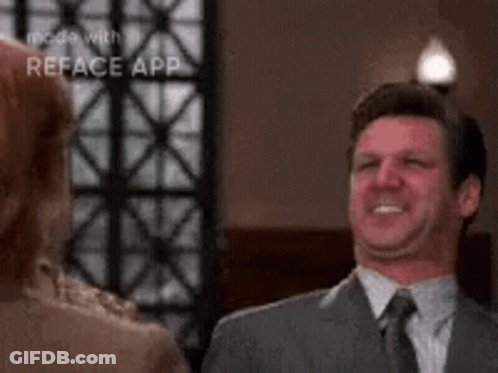 Man In Suit Smiling At Woman GIF