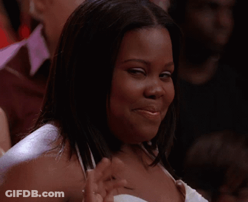 Man In Suit Smiling Before Crowd GIF
