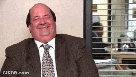 Man In Suit Smiling By Window GIF