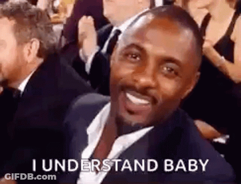 Man In Suit Smiling In Crowd GIF