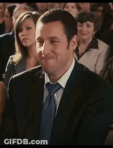 Man In Suit Smiling In Crowd GIF