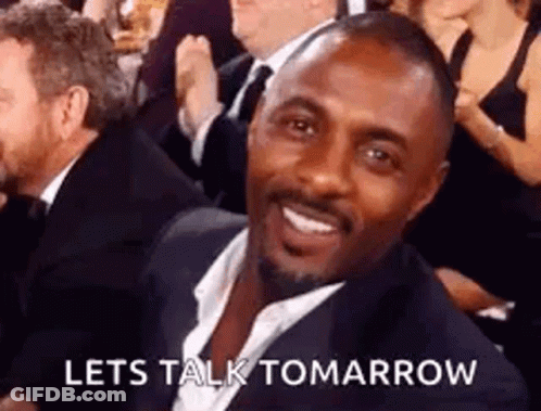 Man In Suit Smiling In Crowd GIF