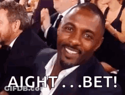 Man In Suit Smiling In Crowd GIF