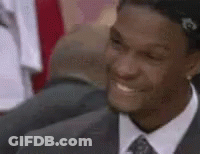 Man In Suit Smiling In Crowd GIF