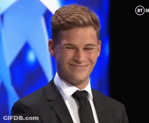 Man In Suit Smiling In Front Of BT Ad GIF