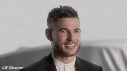 Man In Suit Smiling In Front Of Car GIF