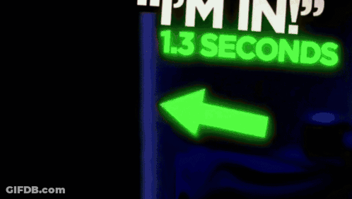Man In Suit Smiling In Front Of Sign GIF