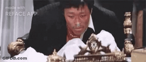 Man In Suit Smiling In Front Of Stanley Cup Banner GIF