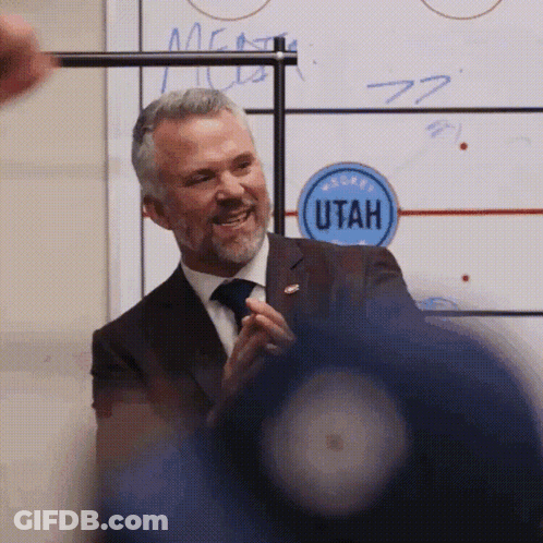 Man In Suit Smiling In Front Of Utah Whiteboard GIF