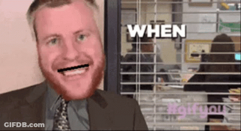 Man In Suit Smiling In Front Of Window Saying When GIF