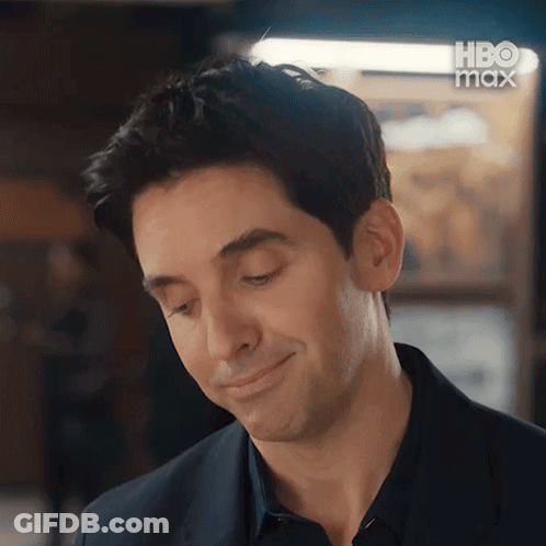Man In Suit Smiling Looking Down GIF