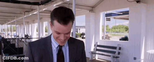 Man In Suit Smiling Looking Down GIF